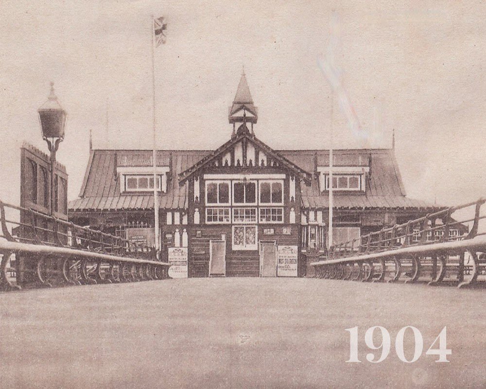 A historic photograph of the pier entrance, 1904
